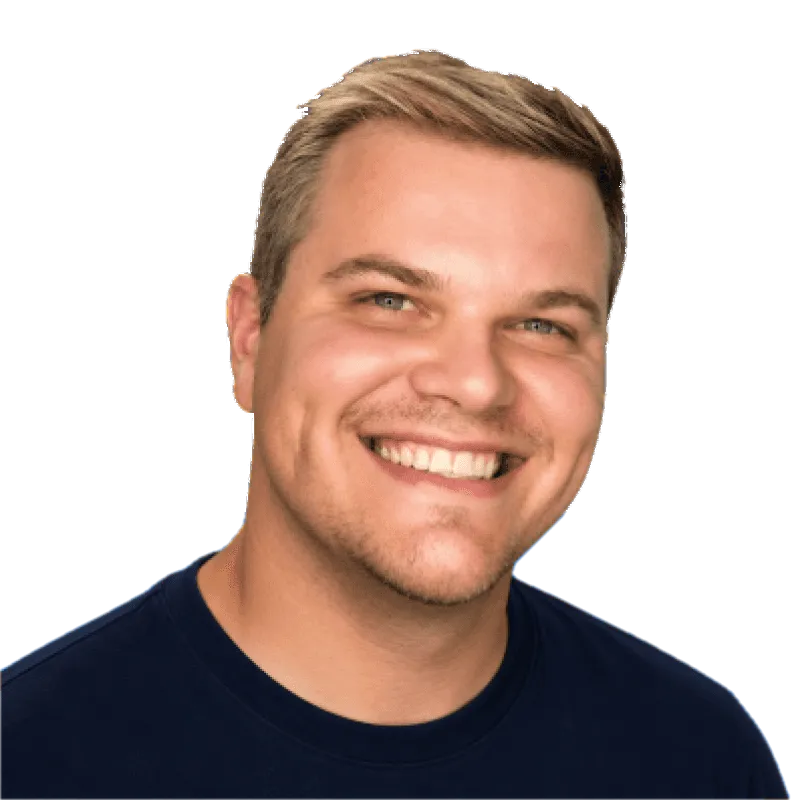 Eric Do Couto, smiling, in a navy t-shirt.